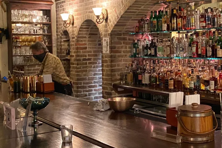 a group of people sitting at a table with wine glasses