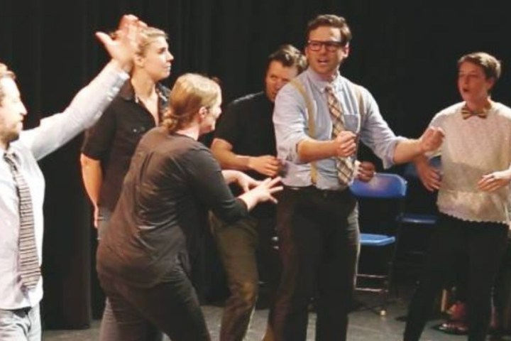 a group of people standing in front of a crowd