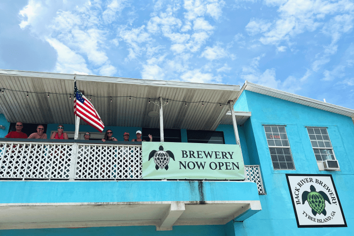 a blue sign in front of a building