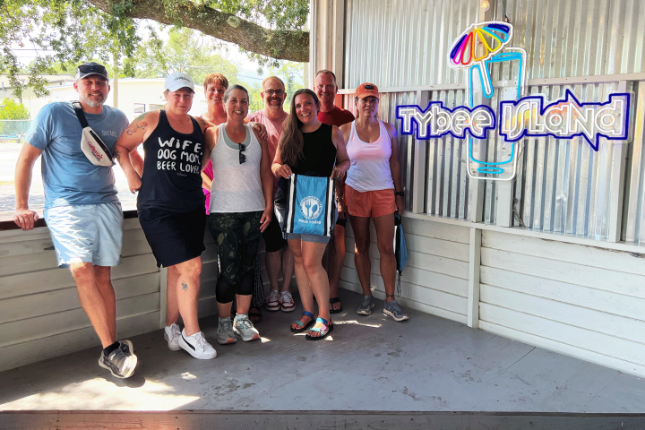 Debi Huang et al. standing on a sidewalk